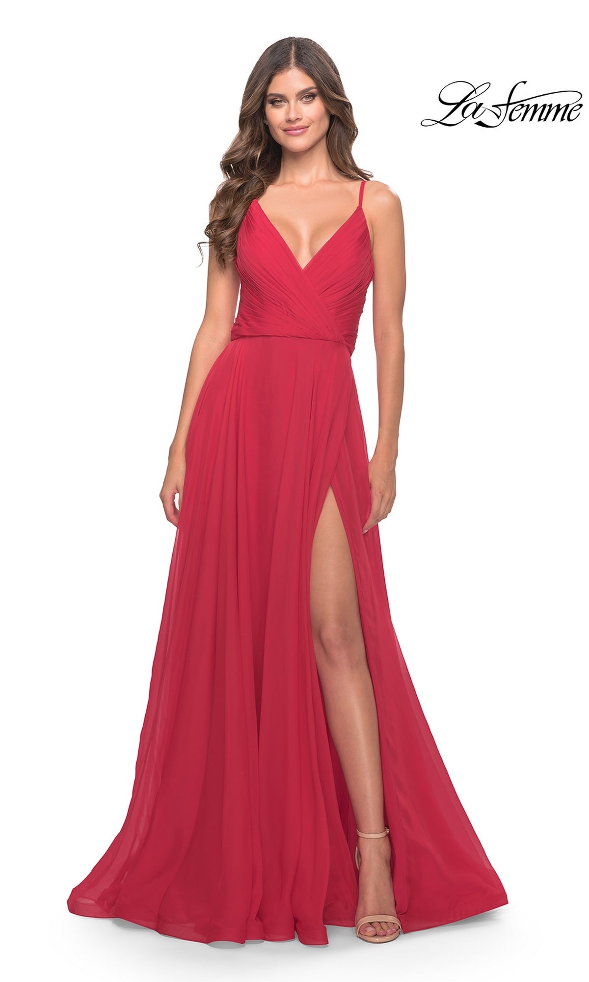 Smiling woman in a sleeveless, floor-length La Femme V-Neck Long A-Line Prom Dress 31500 with deep V-neck and high side slit; La Femme logo in top right corner.